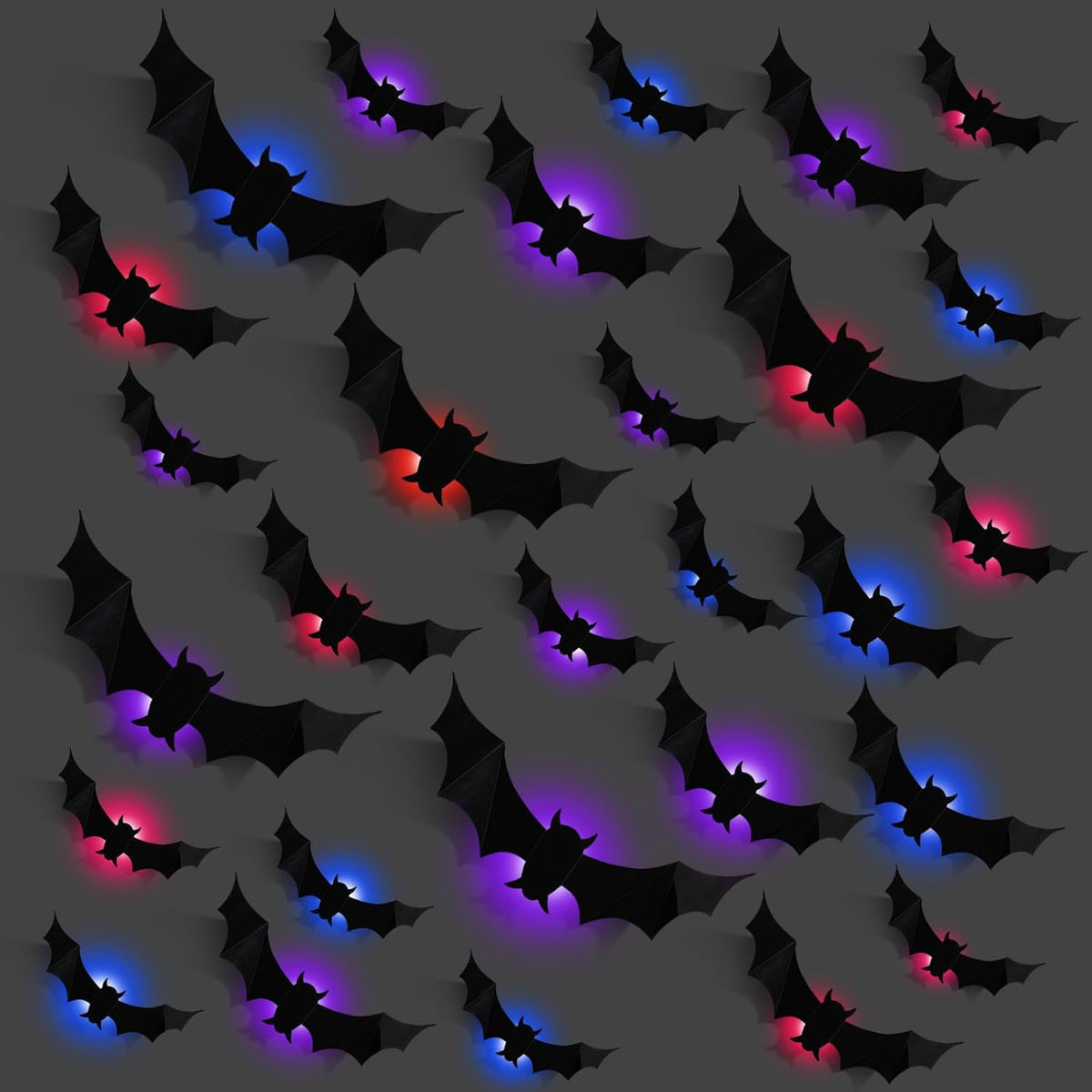 Black 3D bat wall decorations with red, blue and purple glow on a gray wall
