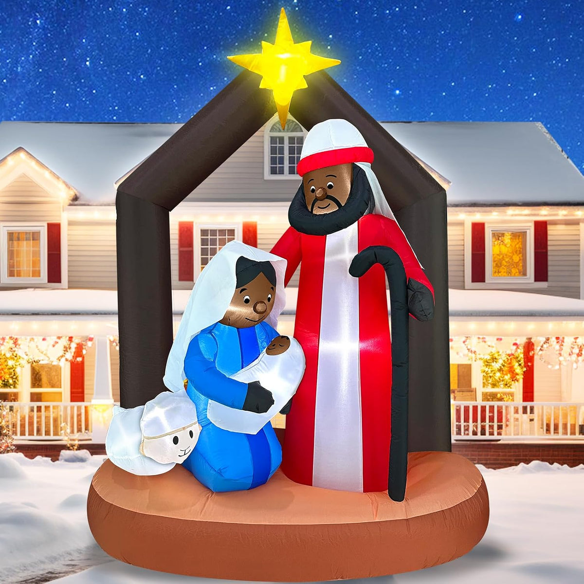 Nativity inflatable with a Black Holy Family under a dark stable roof with a gold star in a snowy yard
