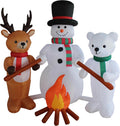 Snowman, reindeer and polar bear inflatables roasting marshmallows around a campfire