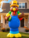 Giant turkey inflatable in blue overalls and a yellow hat holding corn in front of a house