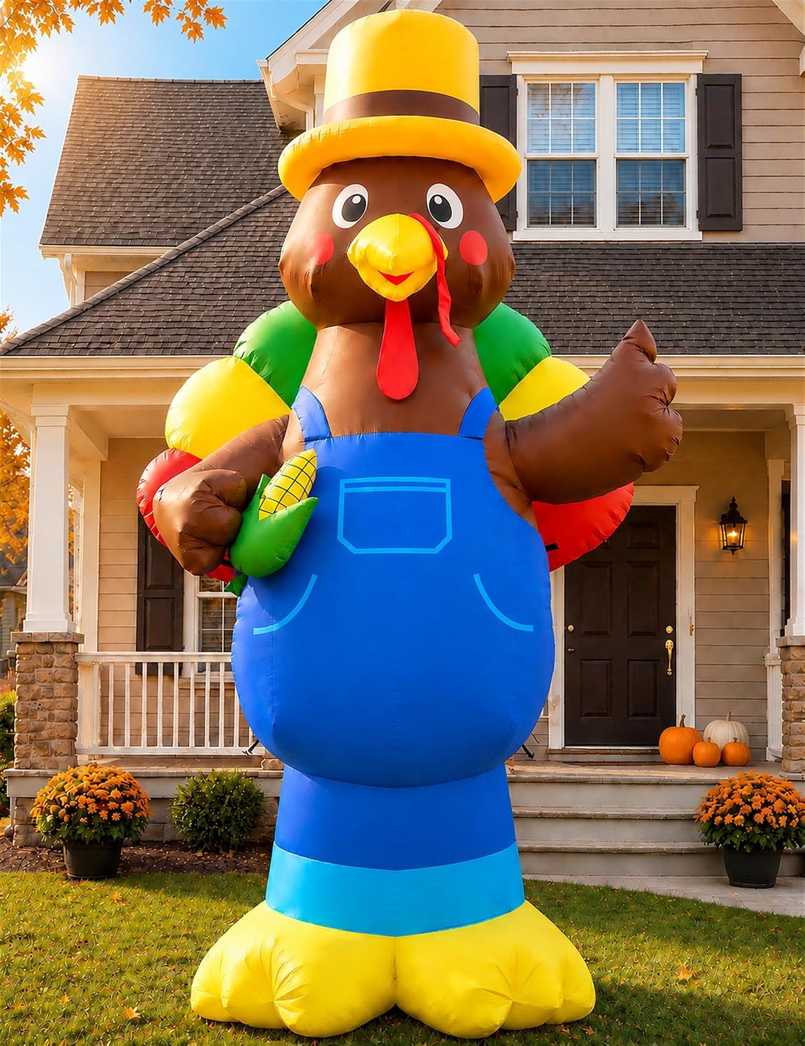 Giant turkey inflatable in blue overalls and a yellow hat holding corn in front of a house