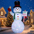 Giant snowman inflatable in a top hat holding a star and a candy cane sign with a glowing multicolor base