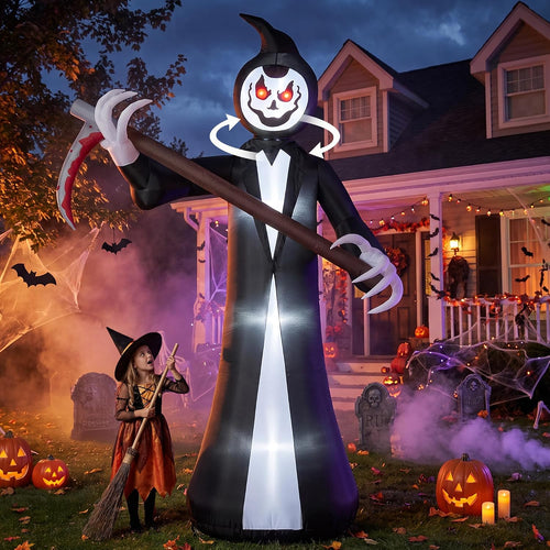 Tall grim reaper inflatable with a skull face holding a scythe in a Halloween yard