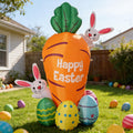 Giant Happy Easter carrot inflatable with two bunnies and colorful eggs on a lawn