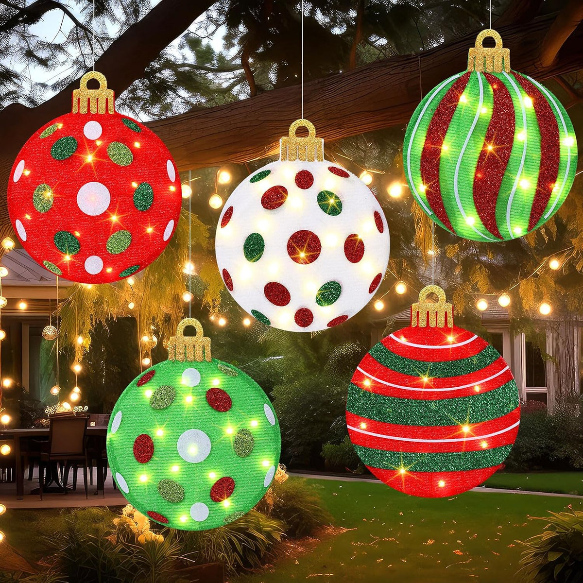 Five glowing glitter Christmas ornament ball lights in red, green and white hanging from a tree
